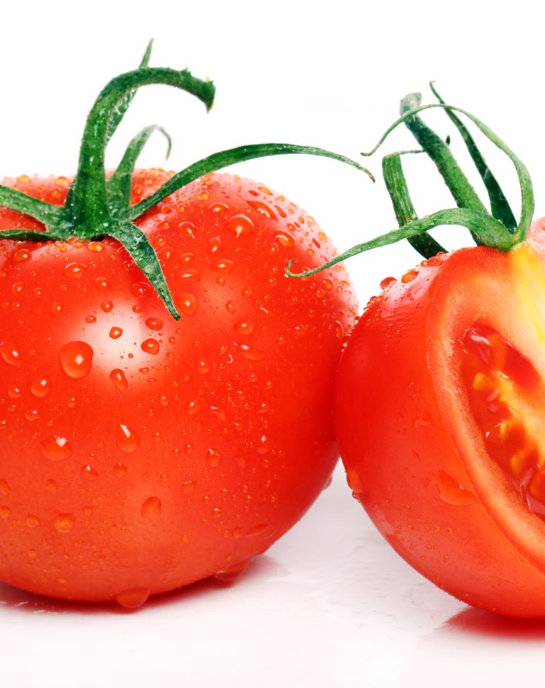 Fresh and tasty tomatoes over white background